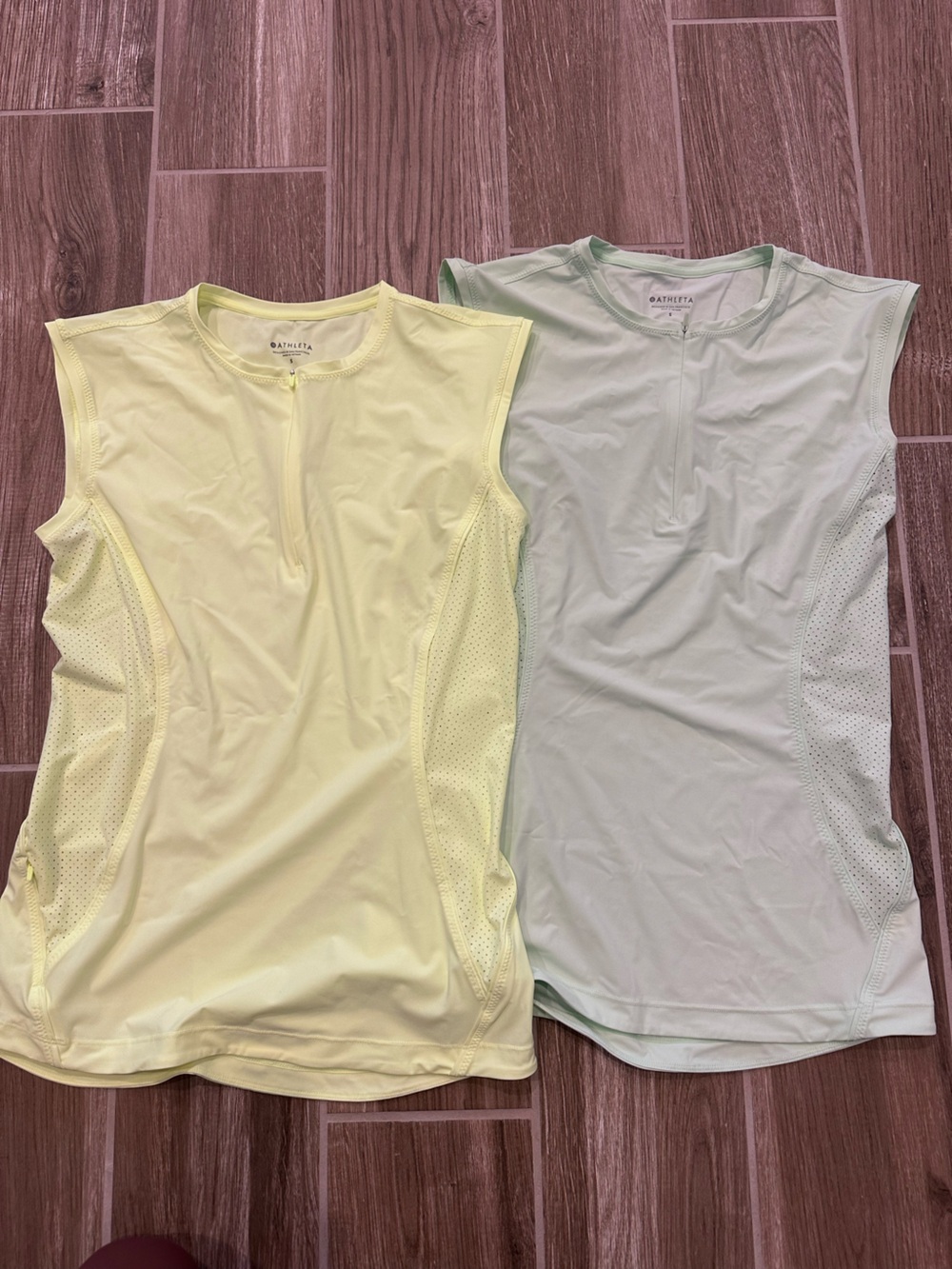 Athleta sleeveless athletic tops in pale yellow and mint